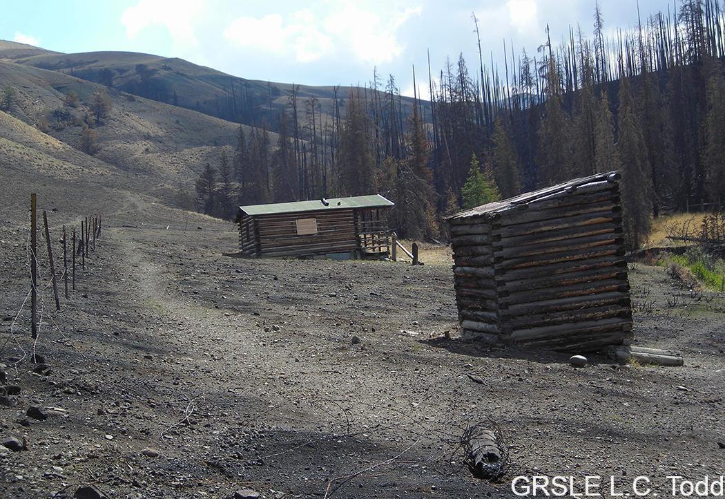 Haymaker cabin and outhouse, view east